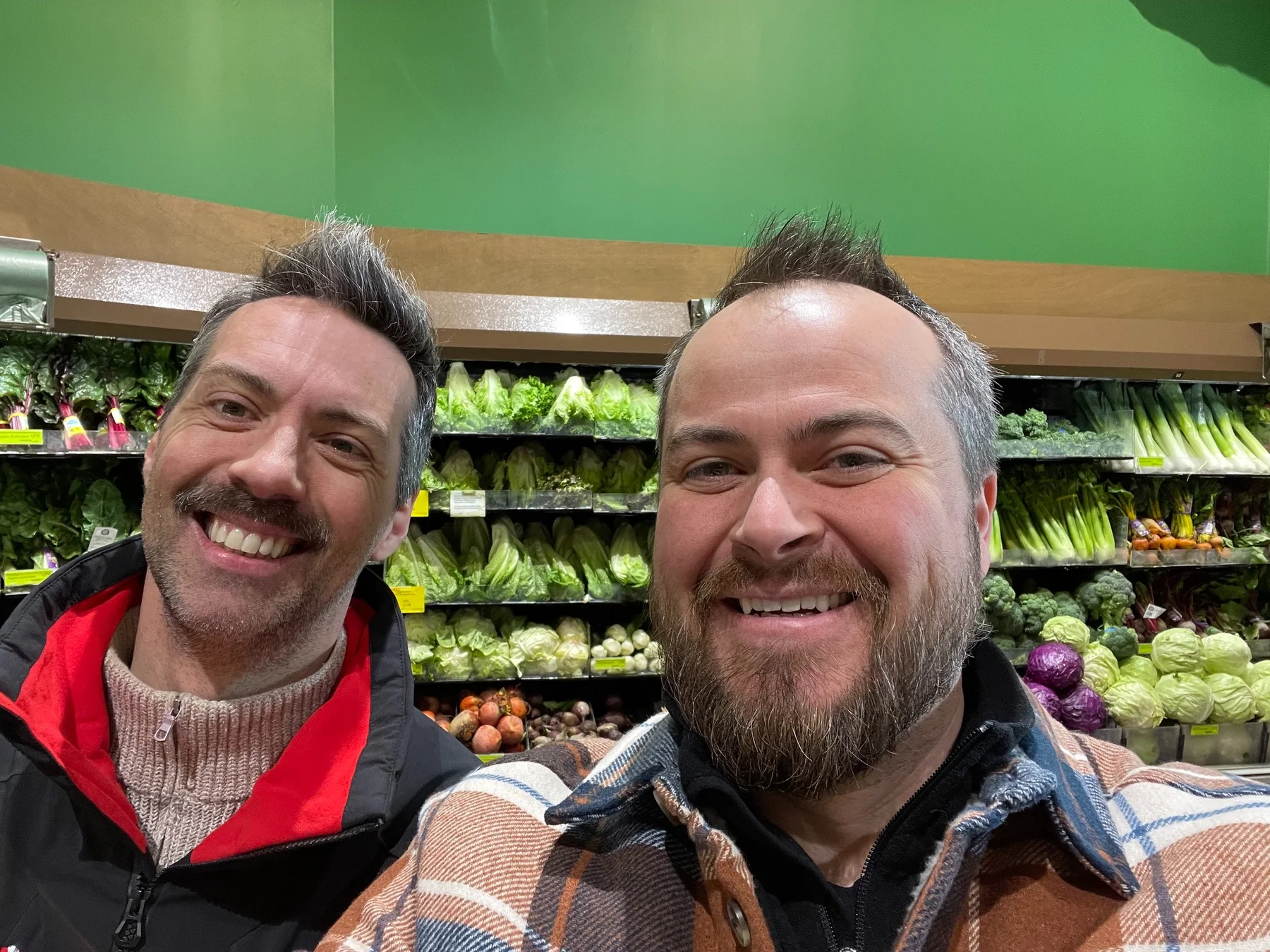 Devon and Jérôme together in a produce market